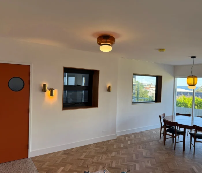 Open dining area with warm pendant lights and modern décor.